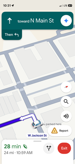 iPhone screenshot of Google Maps navigation heading toward N Main St with a left turn ahead, 28 minutes and 24 miles remaining on the route at W Jackson St.