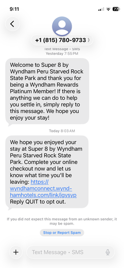 iPhone screenshot of SMS text messages from Super 8 by Wyndham Peru Starved Rock State Park, including a welcome message thanking for Wyndham Rewards Platinum membership and a checkout reminder.