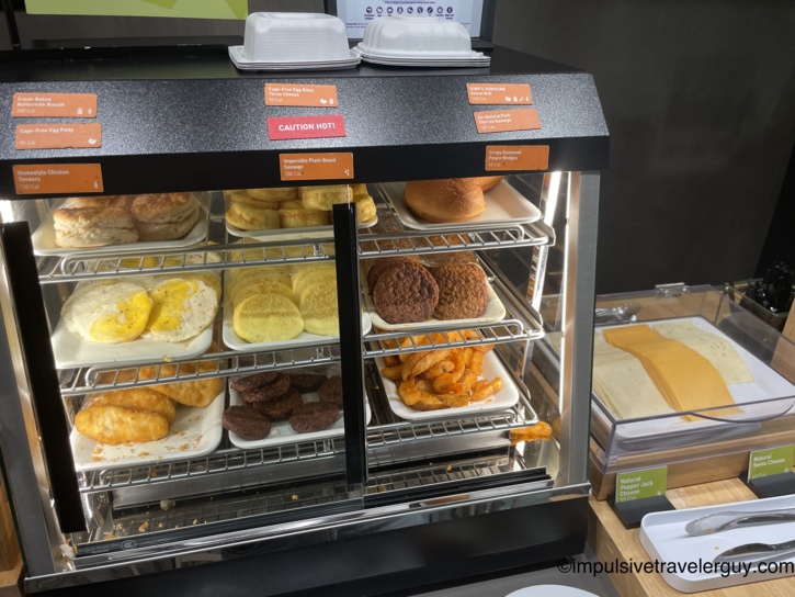 A heated display case at the hotel's Inspired Table breakfast stocked with biscuits, egg patties, sausage, and potato wedges.